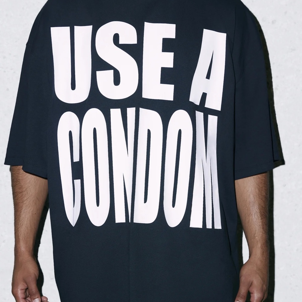 Savage X Fenty Black Tee with Large White 'USE A CONDOM' Graphic